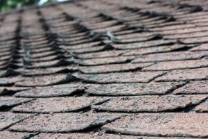 Asphalt shingle roof in need of repair